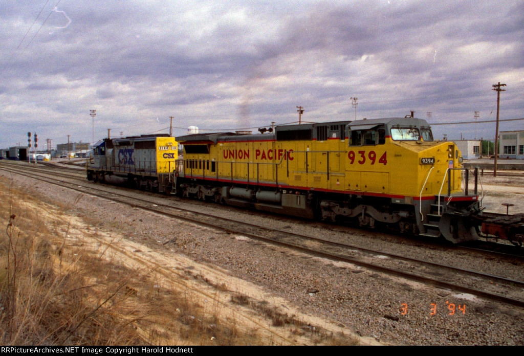 UP 9394 follows CSX 8144 northbound thru the yard